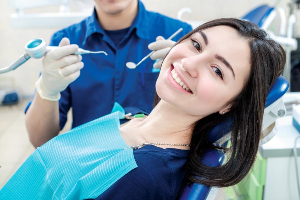 Patient smiling at professional dental cleaning in Van Nuys CA