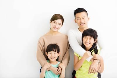 Family of dental patients posing at our Van Nuys, CA dentist office