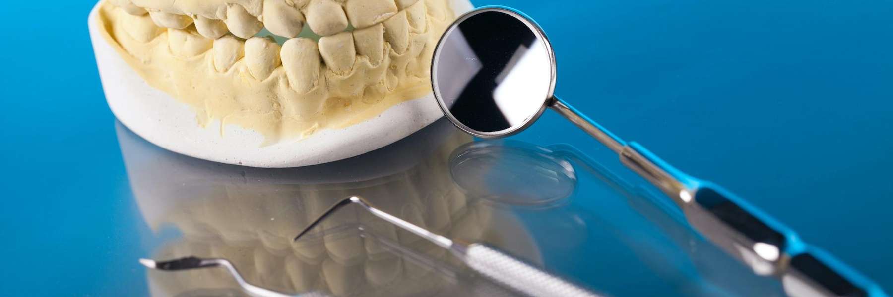 An illustration of a Dental crown and tools in the Dental Care Center, Van Nuys, CA