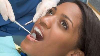 A patient undergoing a comprehensive oral surgery in The Dental Care Center, Van Nuys, California