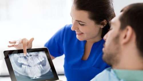 A demonstration of a dental implant in The Dental Care Center, Van Nuys, California.