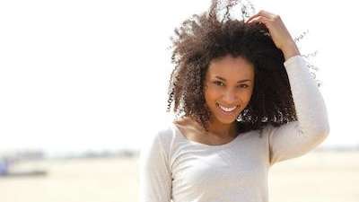 A lady smiling after teeth whitening in Van Nuys, CA