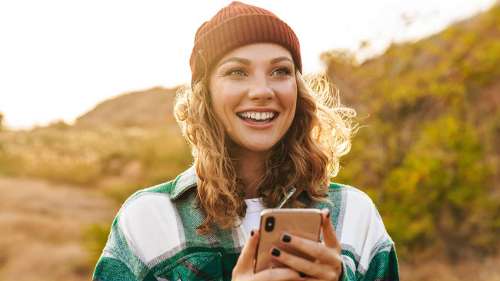A woman smiling after getting a Cosmetic Dentistry in Van Nuys, CA