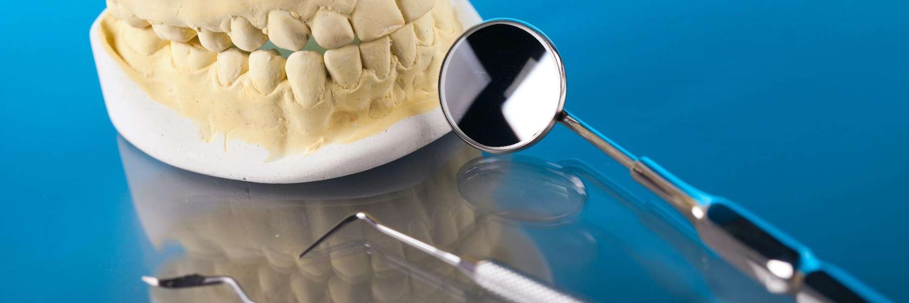 An illustration of a Dental crown and tools in the Dental Care Center, Van Nuys, CA