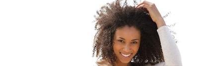 A lady smiling after teeth whitening in The Dental Care Center, Van Nuys, California 