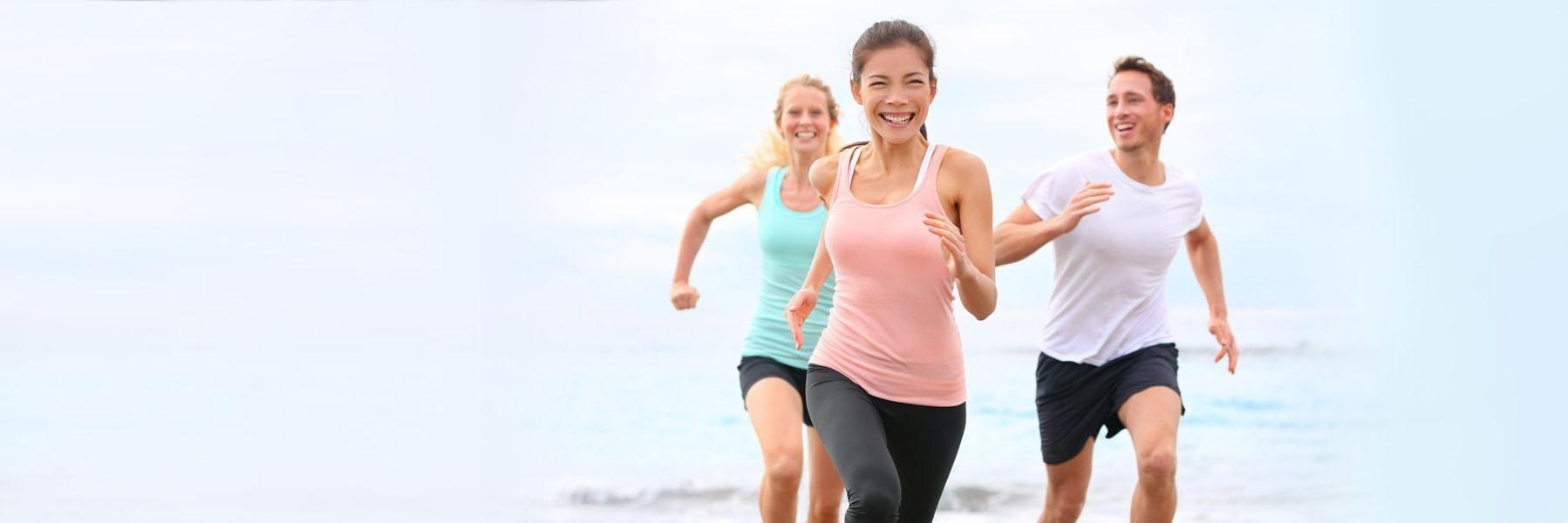 Dental patients running on the beach near 91405